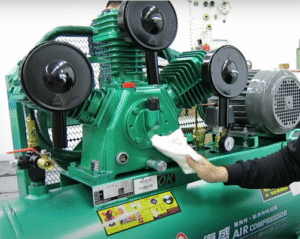 Use a clean cloth to wipe the exterior surface of an air compressor pump after servicing.