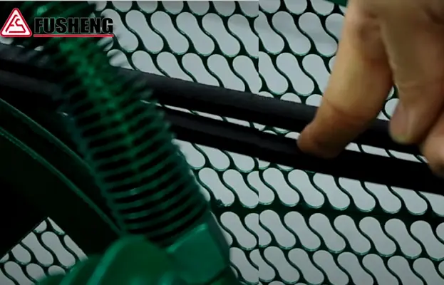 Technician using his index finger to press on an air compressor belt to check its tension and deflection.